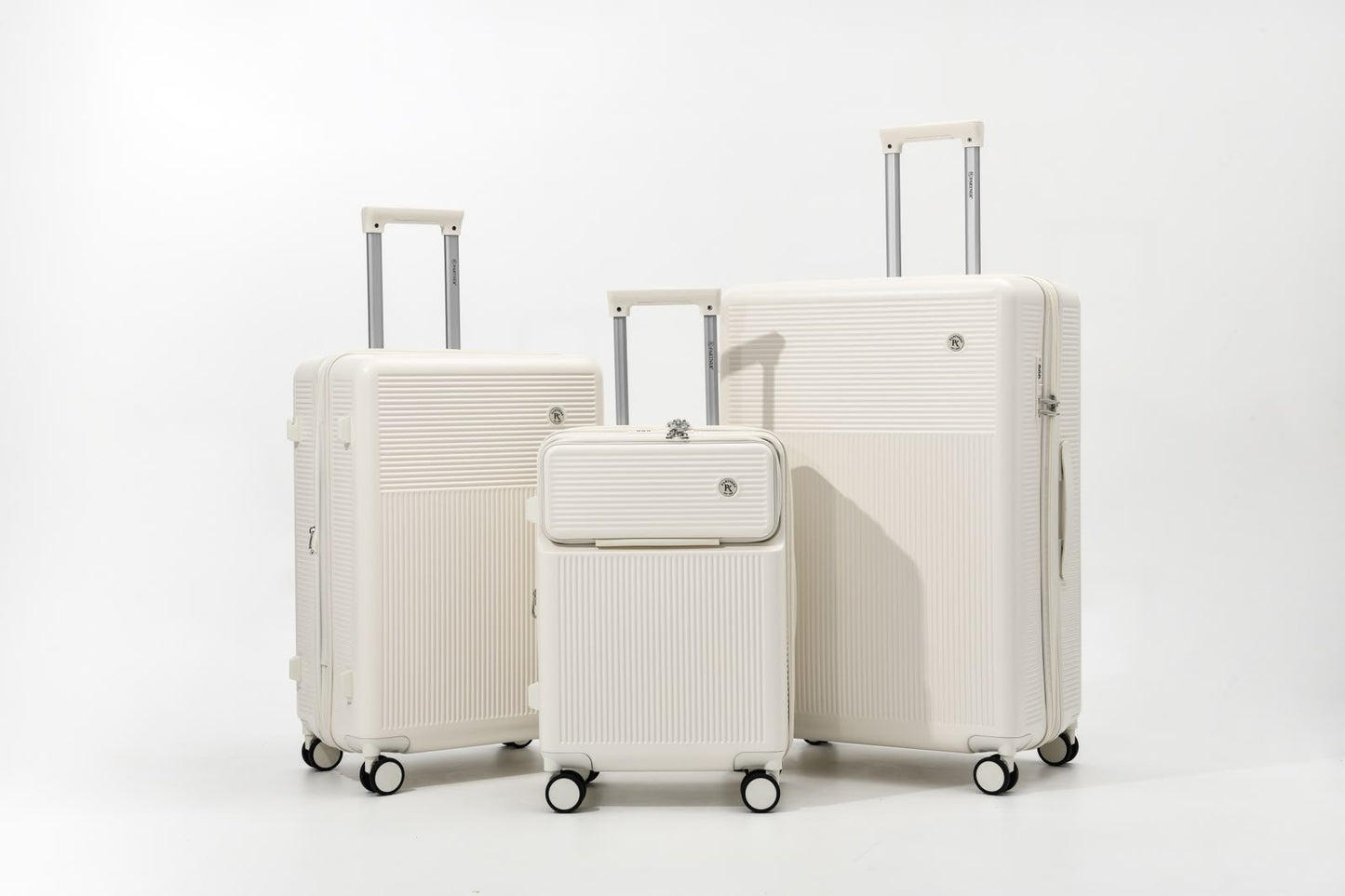 Voyalune ivory four-piece hardside spinner luggage set with vanity case
