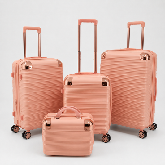 Voyalune soft pink and rose gold four-piece hardside spinner luggage set with vanity case
