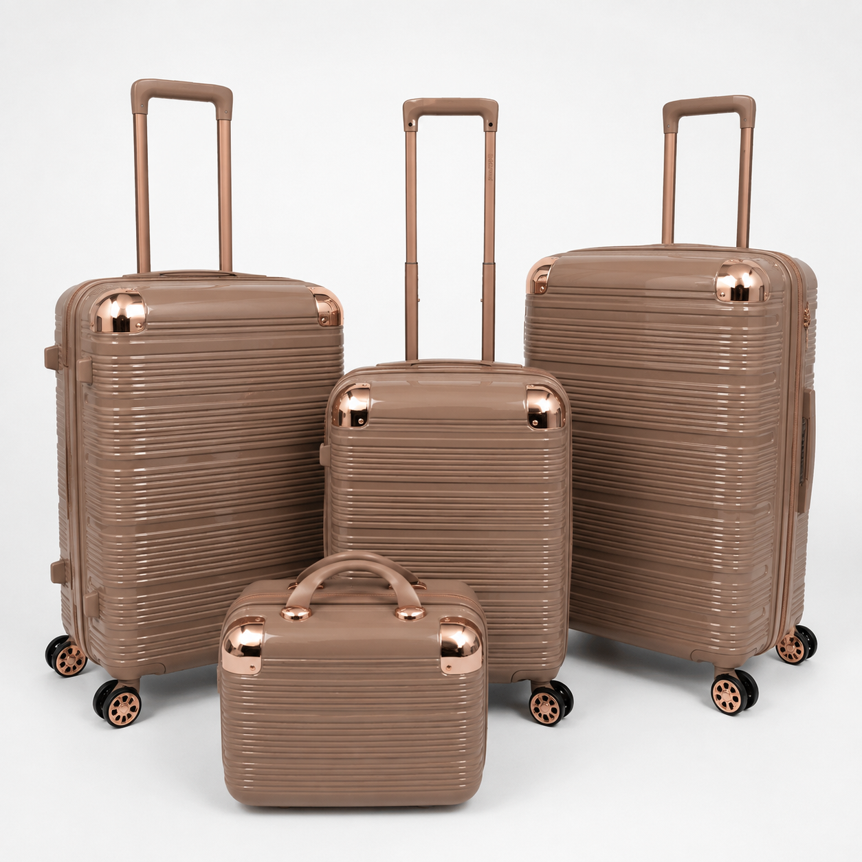 Voyalune tan and rose gold four-piece hardside spinner luggage set with vanity case